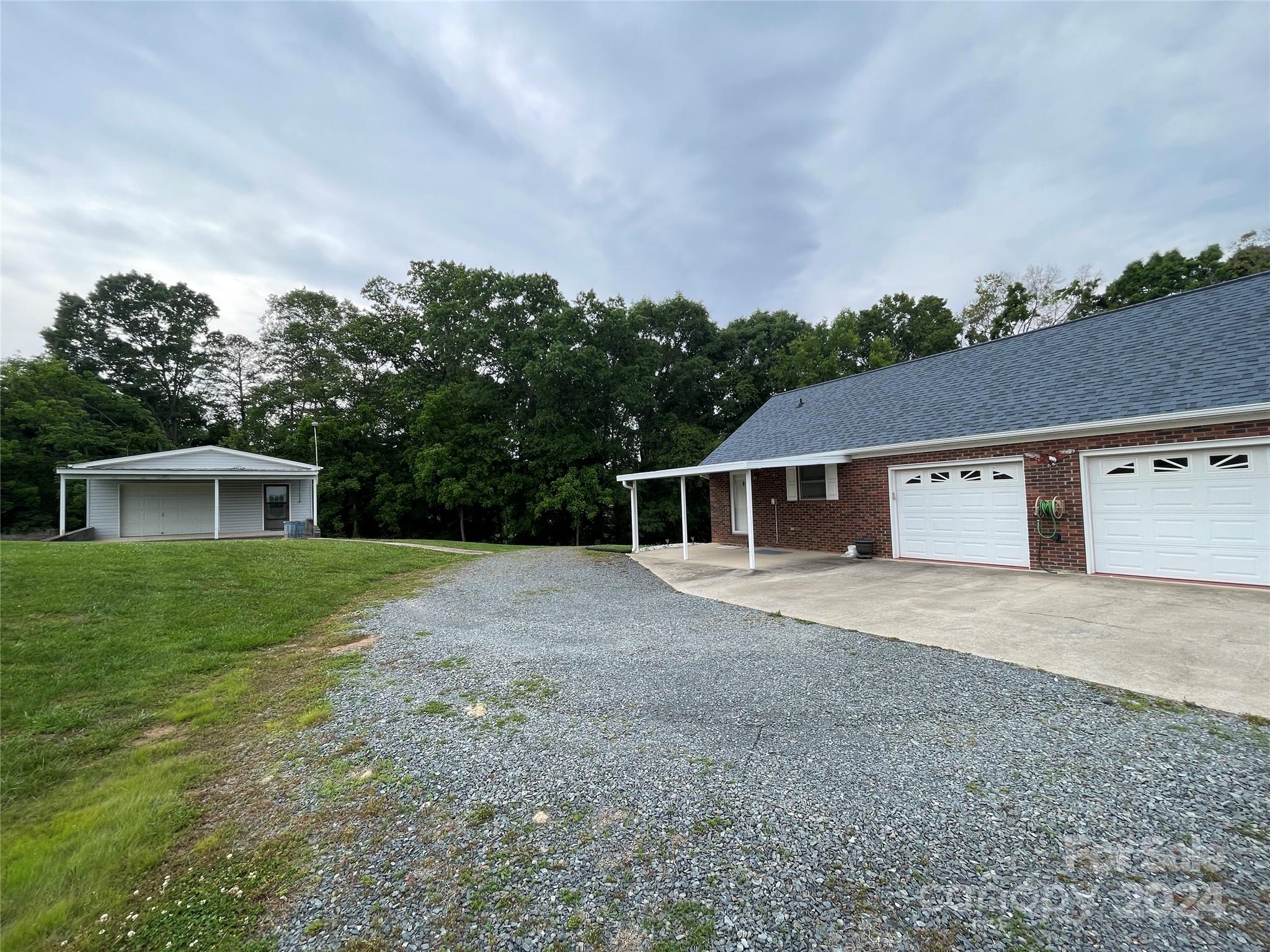 36345 Old Salisbury Road New London, NC 28127 - Photo 46 of 48 a house with trees in the background