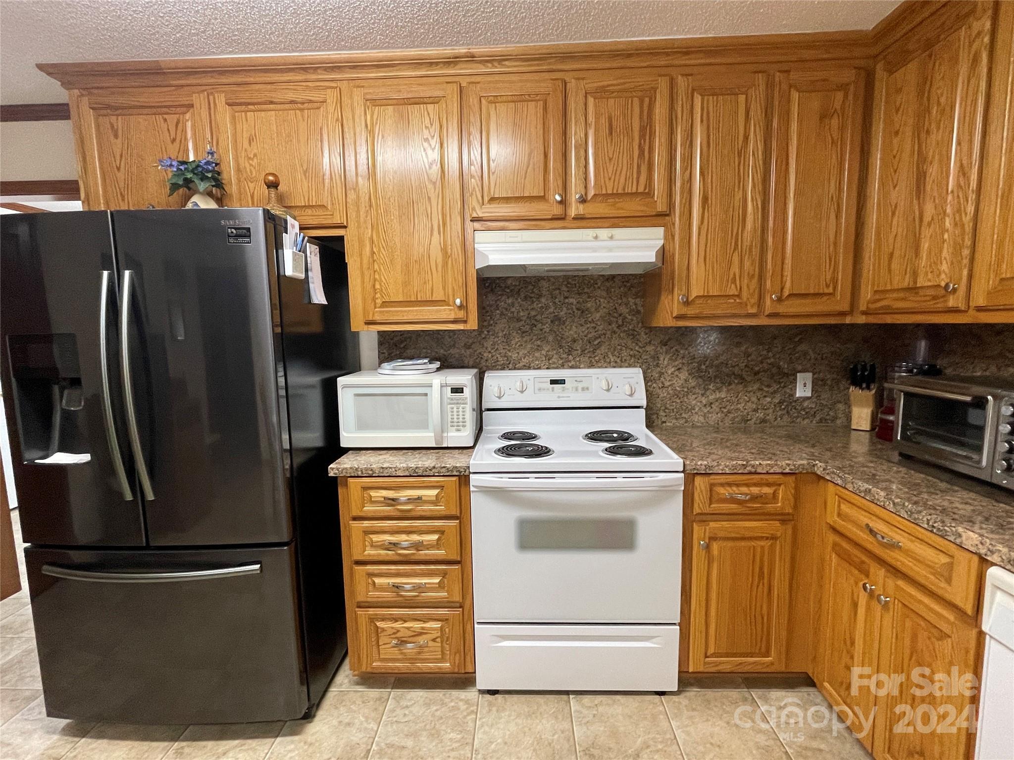 36345 Old Salisbury Road New London, NC 28127 - Photo 8 of 48 a kitchen with appliances cabinets and a counter top space