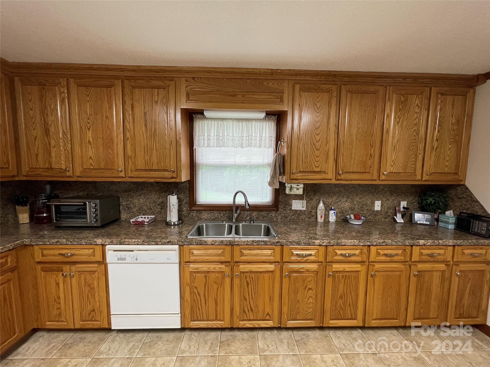 36345 Old Salisbury Road New London, NC 28127 - Photo 9 of 48 a kitchen with stainless steel appliances granite countertop a sink a stove and dishwasher