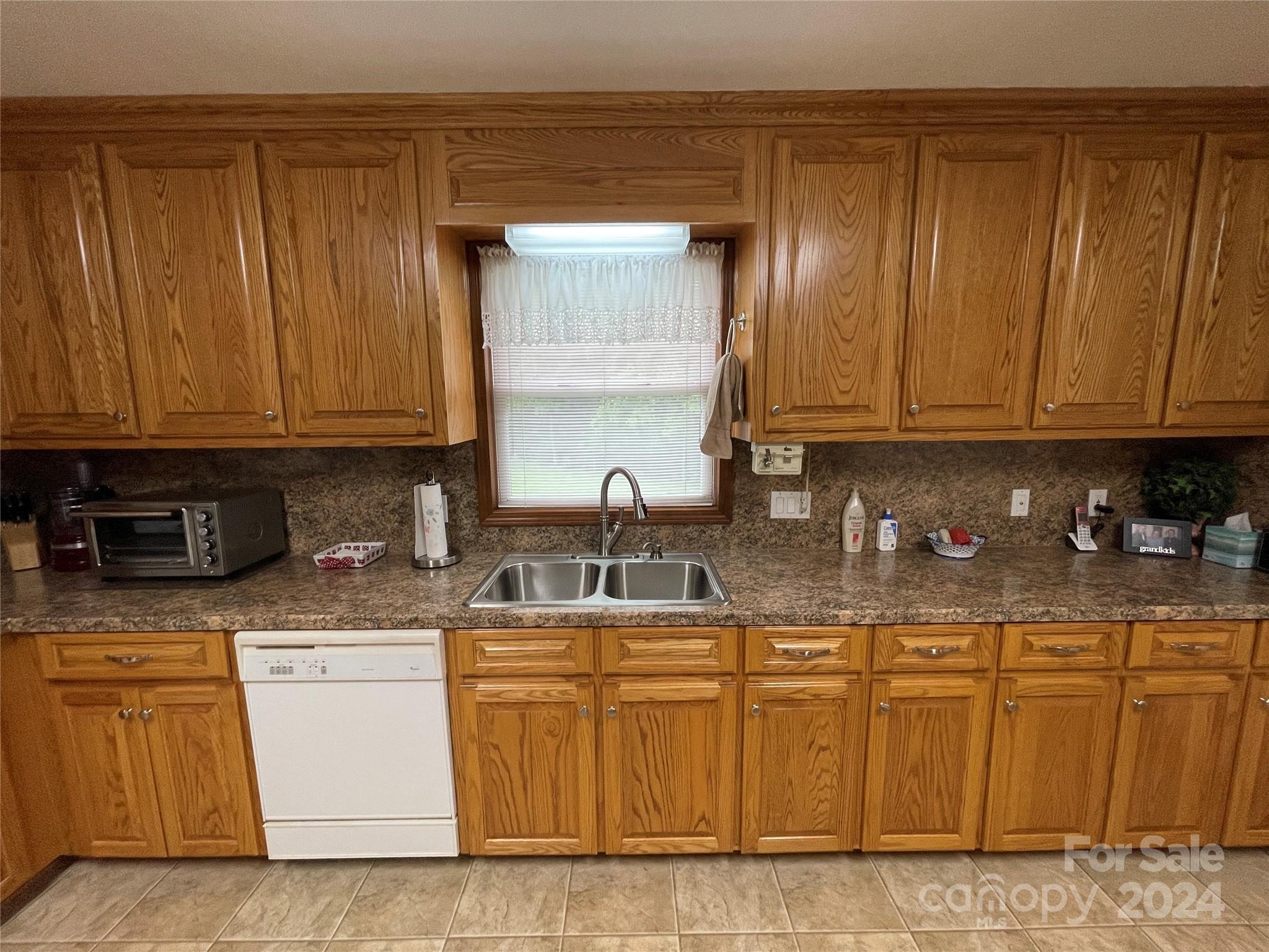 36345 Old Salisbury Road New London, NC 28127 - Photo 10 of 48 a kitchen with stainless steel appliances granite countertop a sink stove and cabinets