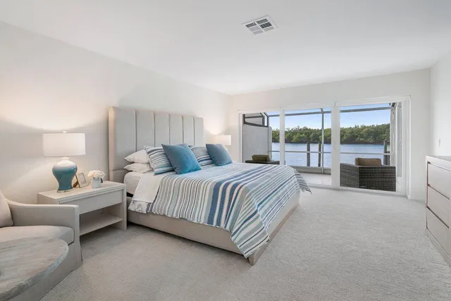 a spacious bedroom with a bed and a couch