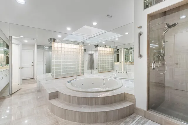 a bathroom with a bathtub and shower
