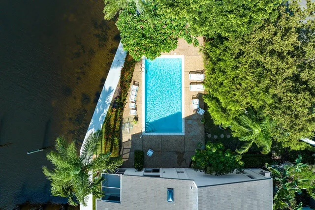 an aerial view of a house with outdoor space