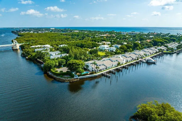 a view of a lake with lawn chairs