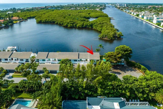 an aerial view of a house with a lake view