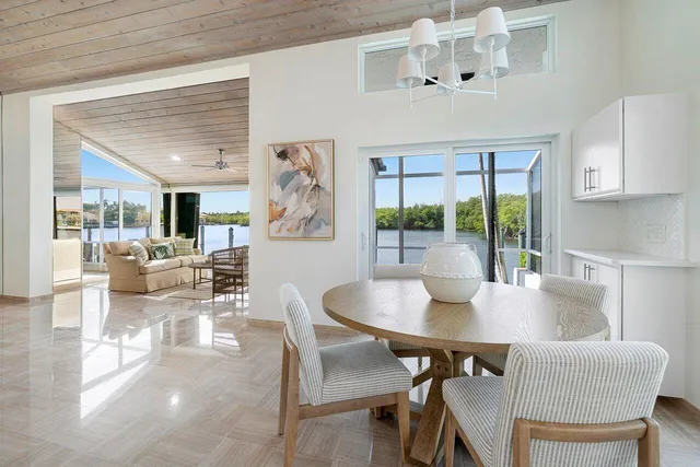 a dining room with furniture and wooden floor
