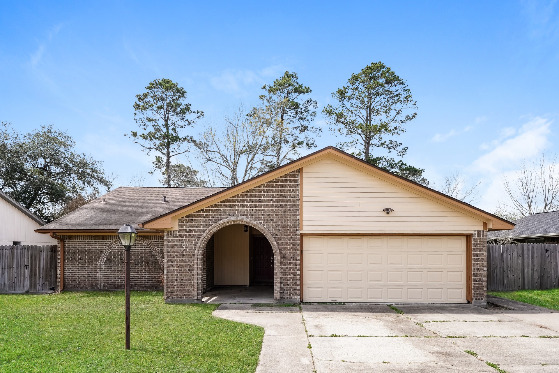 21611 Glenbranch Drive Spring, TX 77388 - Photo 1 of 15 a front view of a house with a garden and plants