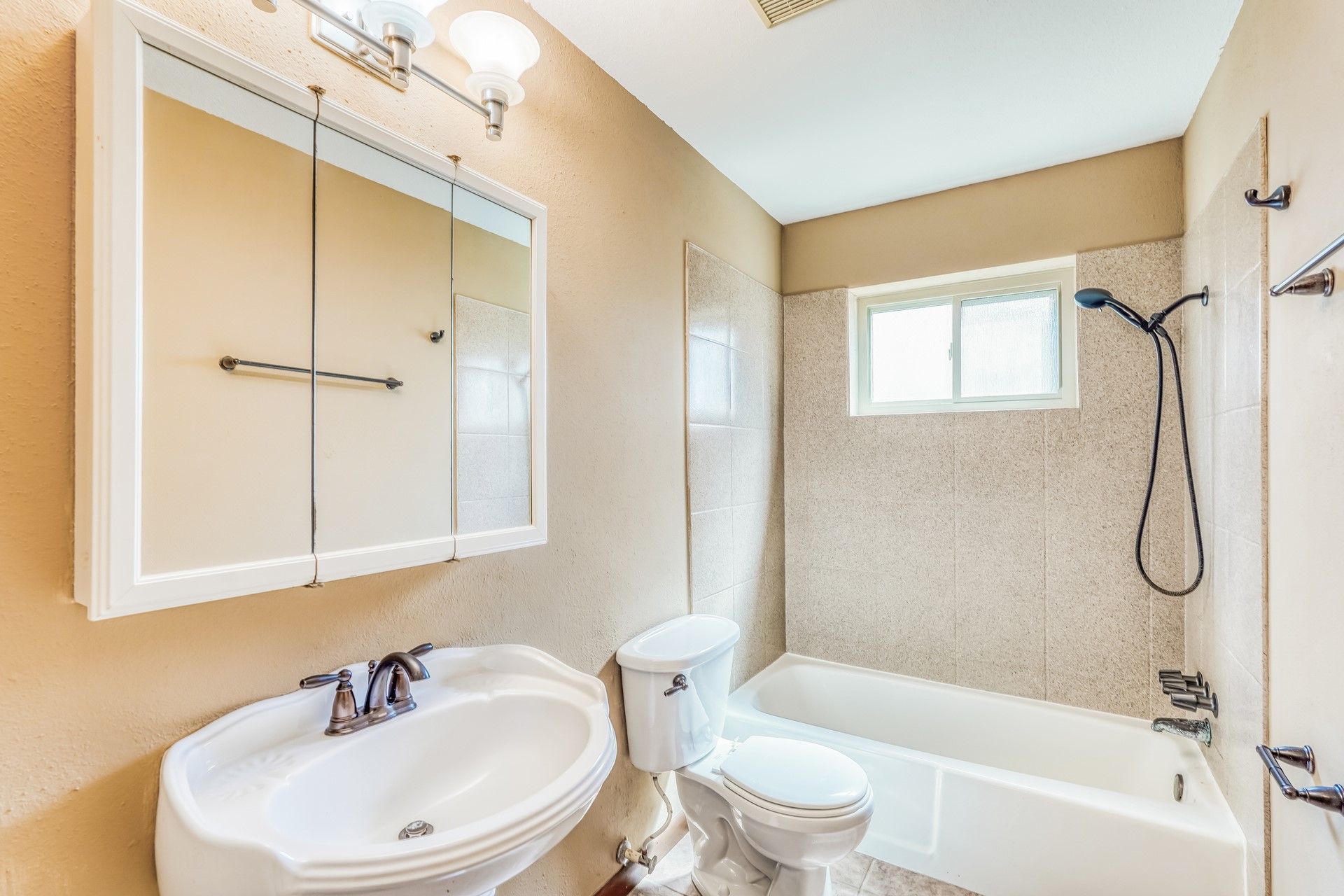 21611 Glenbranch Drive Spring, TX 77388 - Photo 13 of 15 a bathroom with a sink a toilet and a bathtub