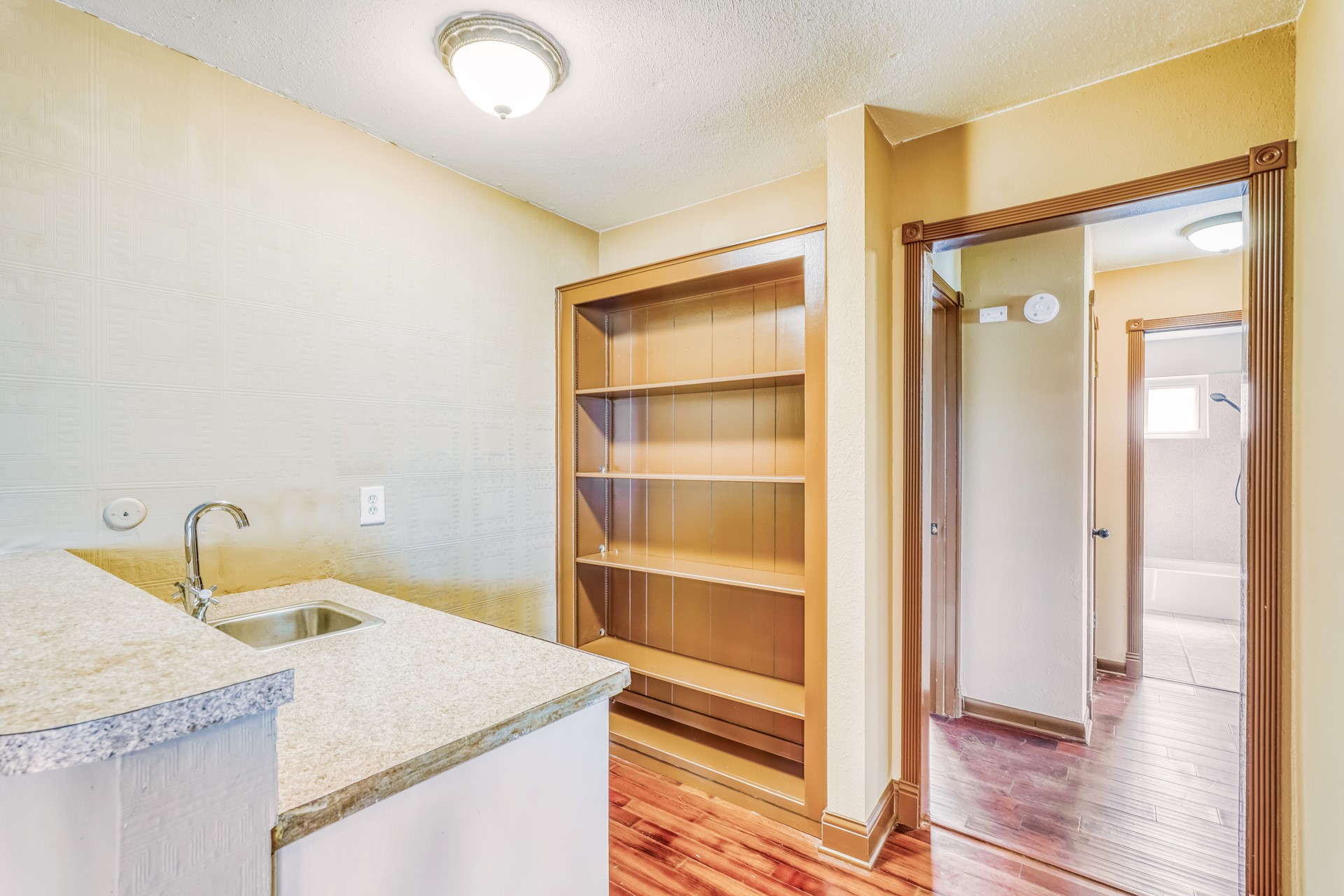 21611 Glenbranch Drive Spring, TX 77388 - Photo 14 of 15 a kitchen that has a sink and a wooden floor