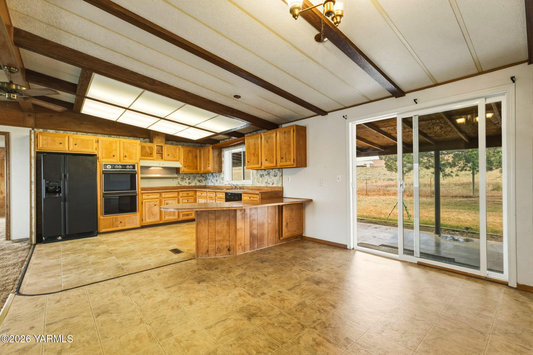 171 Gopher Road Selah, WA 98942 - Photo 5 of 24 a view of a kitchen with a sink and cabinets