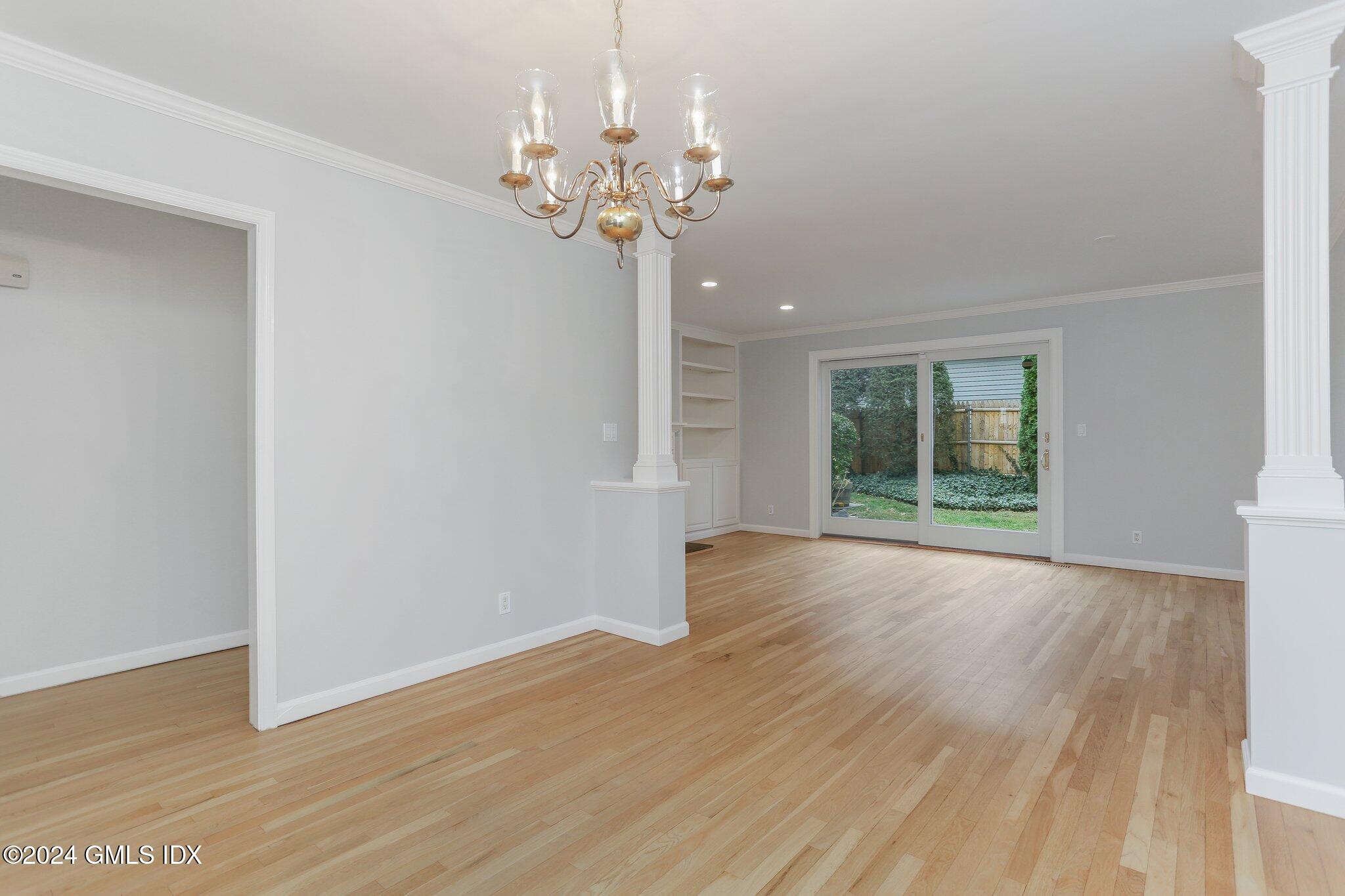 53 Bible Street, Unit 4 Cos Cob, CT 06807 - Photo 11 of 28 a view of a room with wooden floor and window
