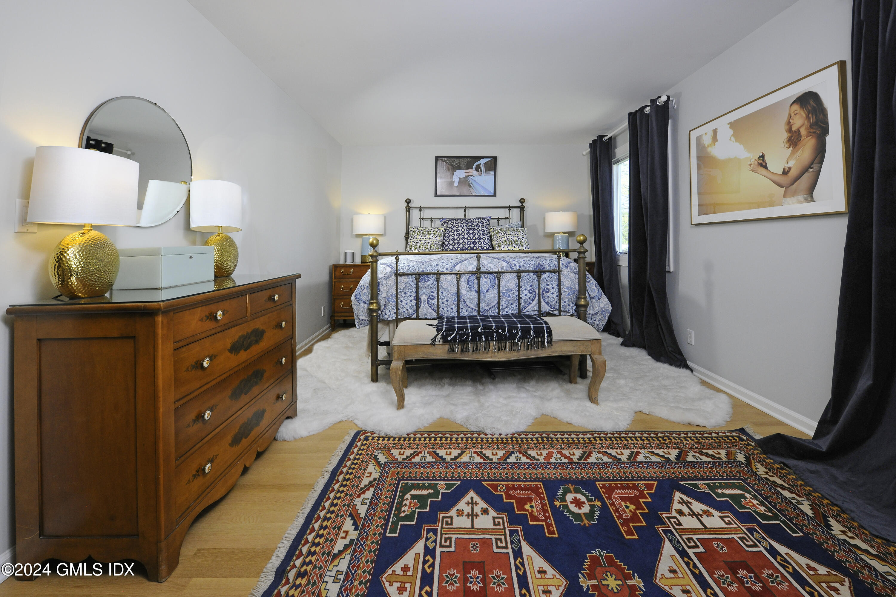 53 Bible Street, Unit 4 Cos Cob, CT 06807 - Photo 15 of 28 a bedroom with a bed and wooden floor