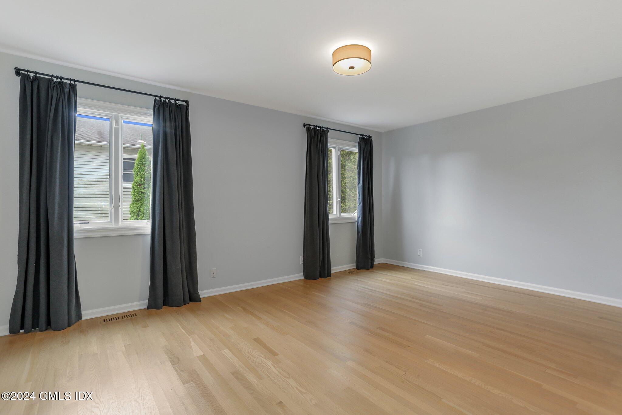 53 Bible Street, Unit 4 Cos Cob, CT 06807 - Photo 16 of 28 a view of an empty room with closet and a window