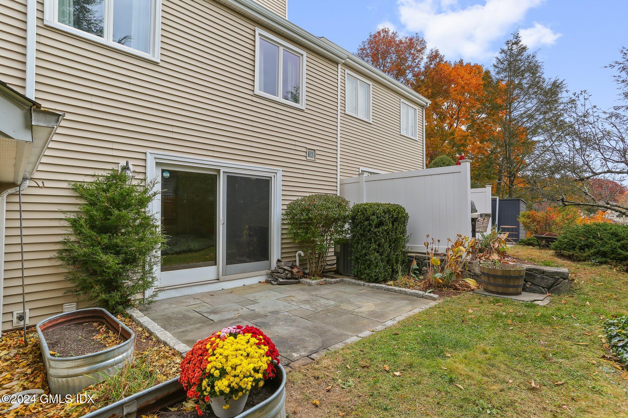 53 Bible Street, Unit 4 Cos Cob, CT 06807 - Photo 20 of 28 a front view of a house with garden