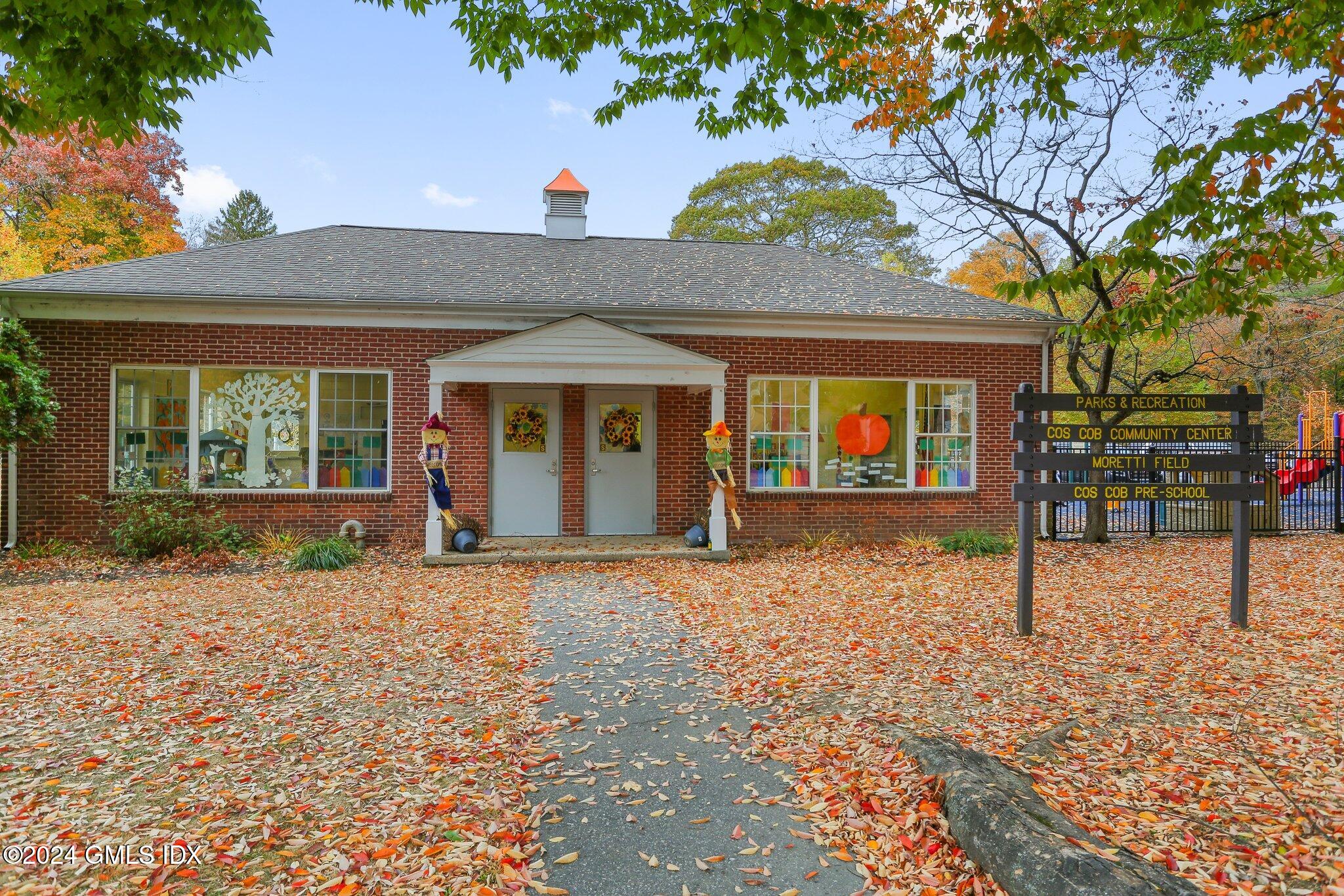 53 Bible Street, Unit 4 Cos Cob, CT 06807 - Photo 27 of 28 a front view of a house with a yard