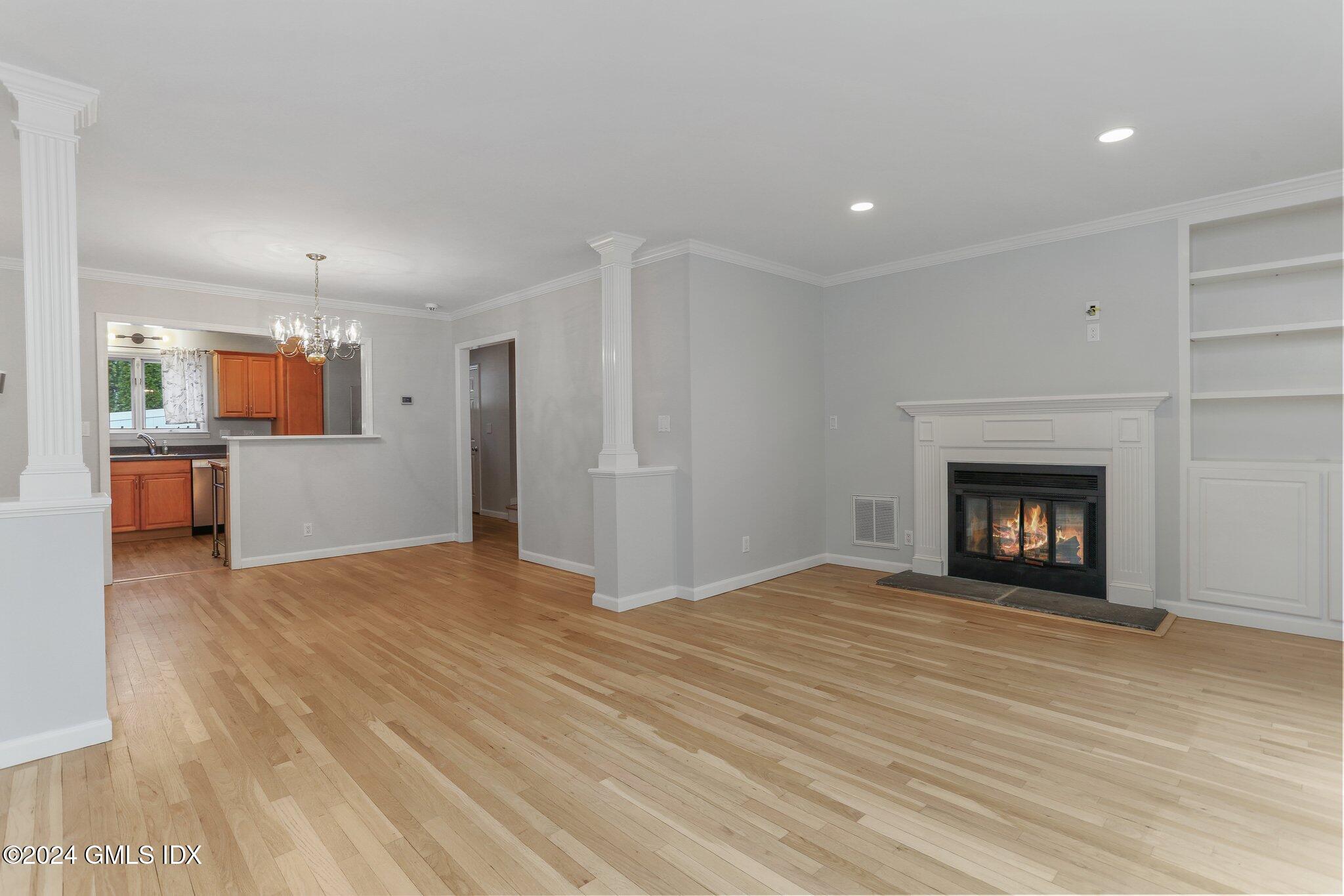 53 Bible Street, Unit 4 Cos Cob, CT 06807 - Photo 9 of 28 a view of an empty room with a fireplace and a window