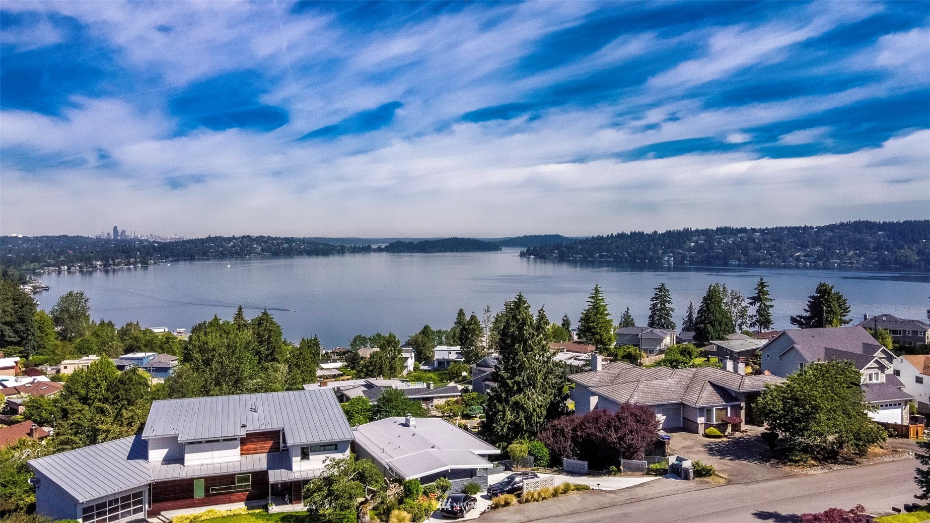 7133 South Sunnycrest Road Seattle, WA 98178 - Photo 4 of 39 an aerial view of a building with outdoor space and lake view