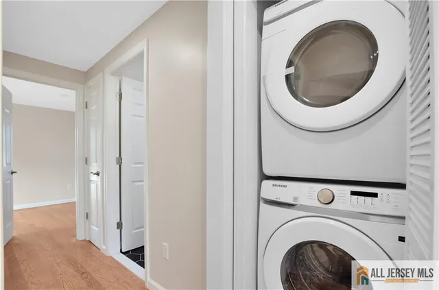 a view of a hallway with washer and dryer