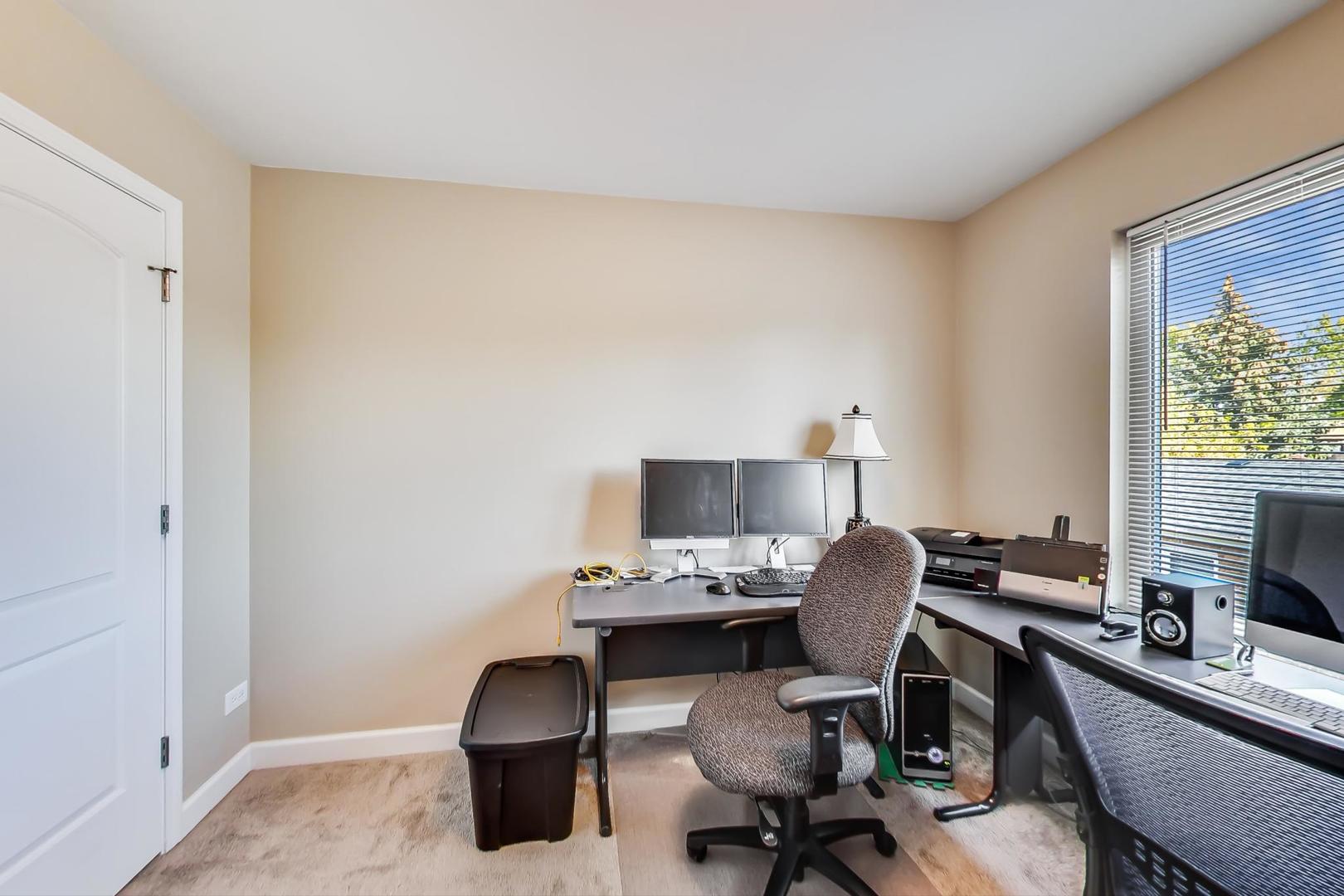 7312 Ogden Avenue Riverside, IL 60546 - Photo 13 of 38 a workspace with furniture and a window
