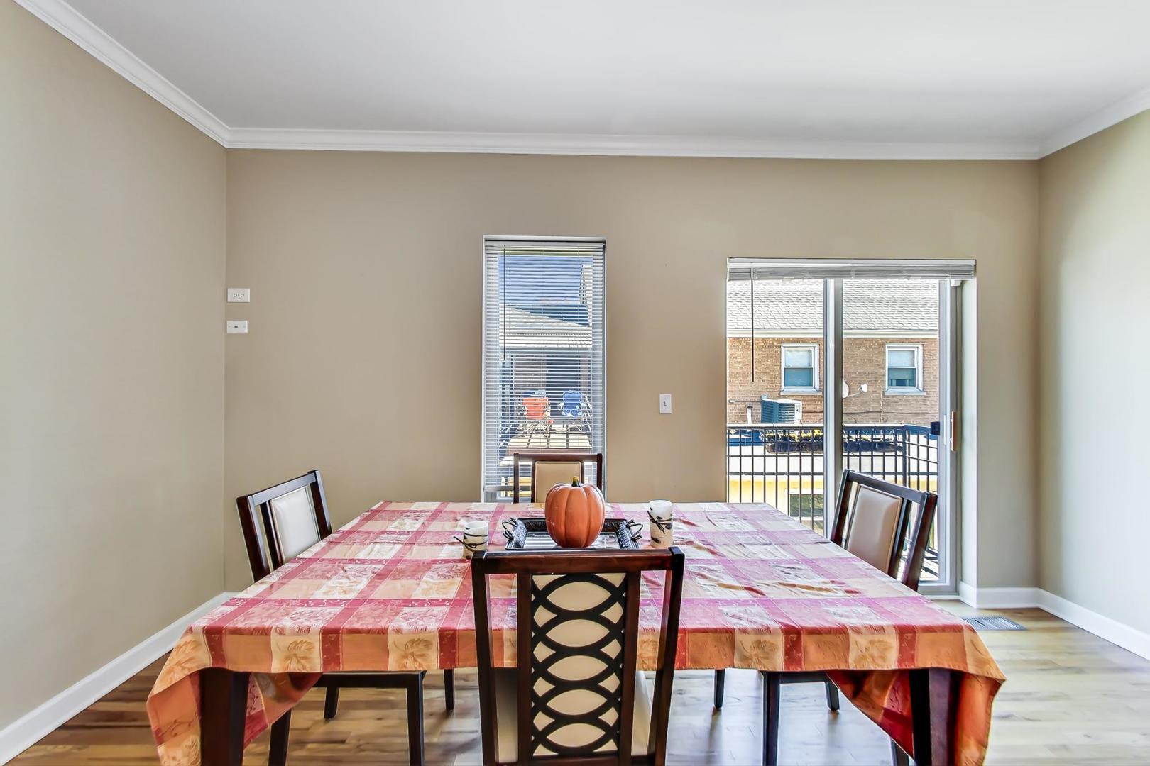 7312 Ogden Avenue Riverside, IL 60546 - Photo 8 of 38 a view of a dining room with furniture and wooden floor