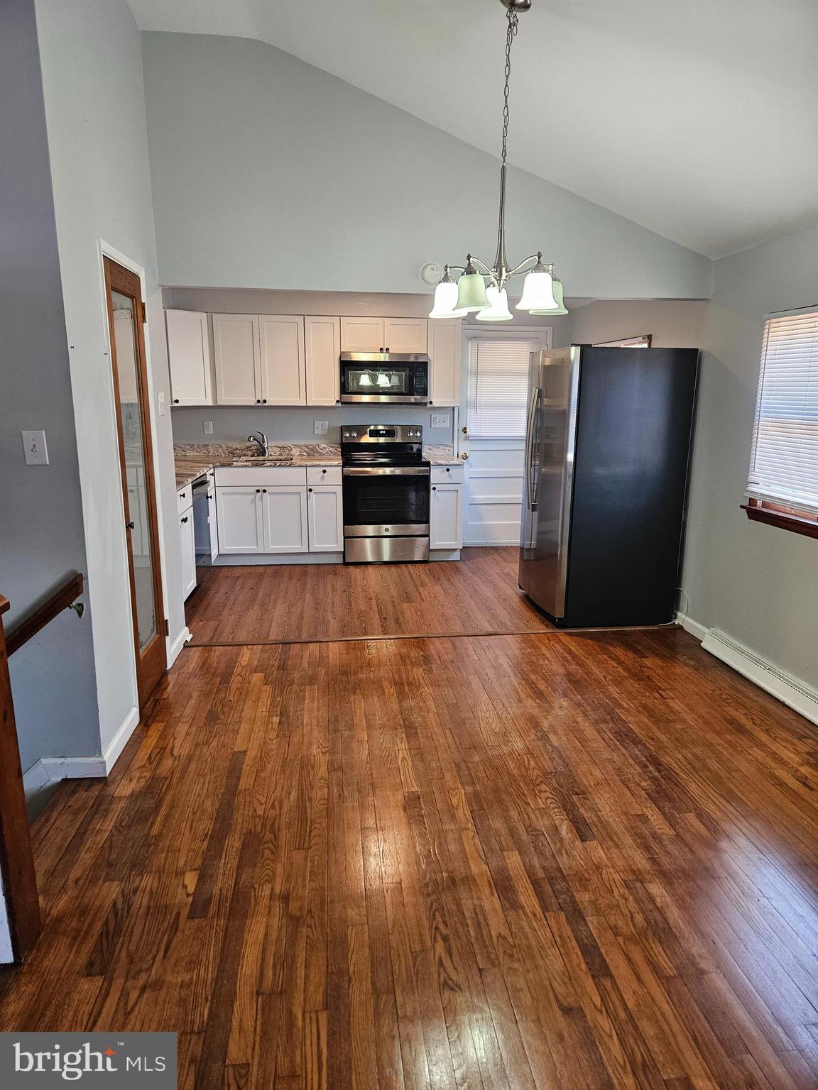29 Malvern Road Newark, DE 19713 - Photo 2 of 14 a kitchen with stainless steel appliances granite countertop a refrigerator a stove and a wooden floors