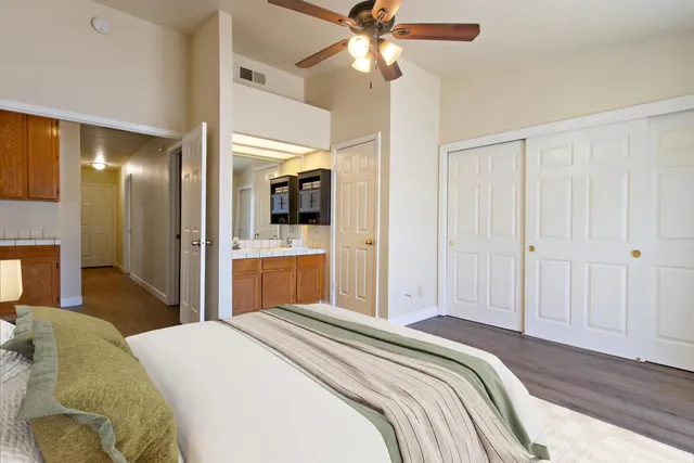 a bedroom with a bed and a chandelier