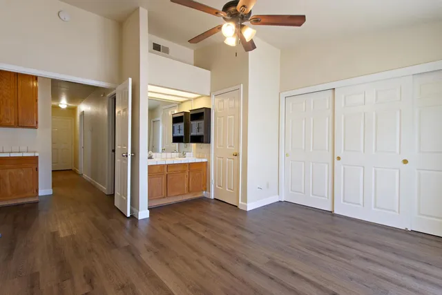 a view of a kitchen with a sink and a kitchen area