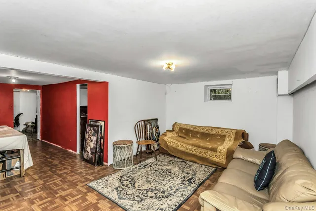 a living room with furniture rug and lamp