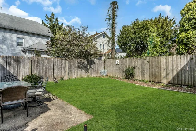 a garden with trees in front of it