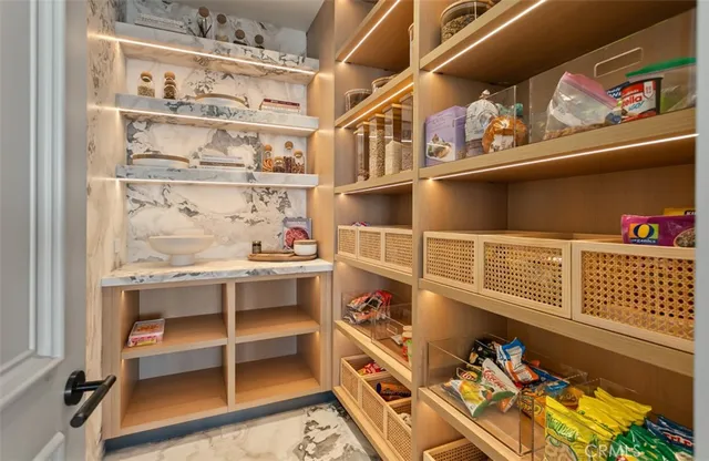 a view of a patio with a dining table and chairs