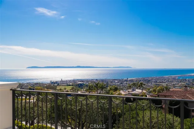 a view of a balcony with furniture and a chandelier