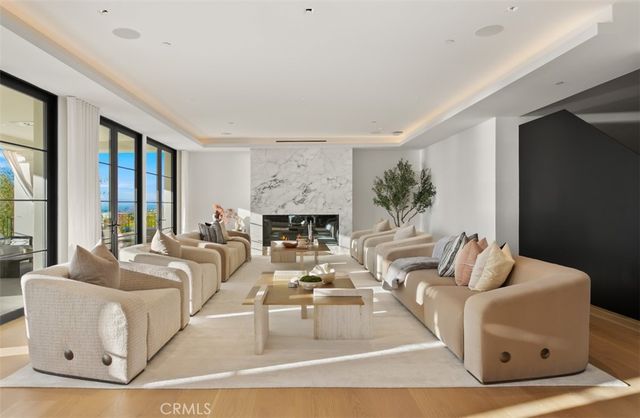 a bathroom with a sink and mirror with bathtub