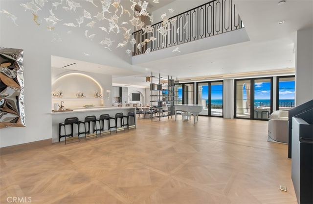 a dining room with furniture and a chandelier