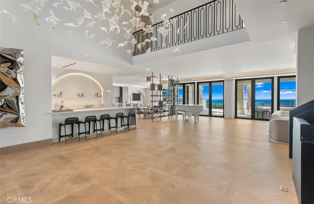 a dining room with furniture and a chandelier