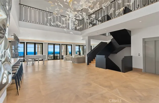 a dining area with furniture and a large window