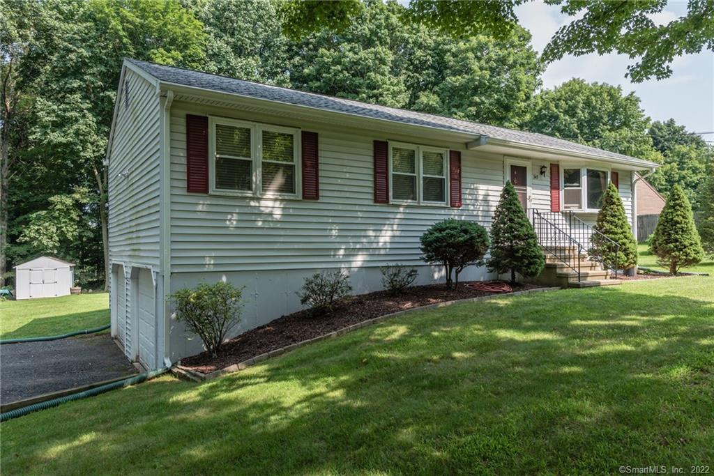 349 Todd Road Wolcott, CT 06716 - Photo 1 of 1 a view of a house with a yard and plants