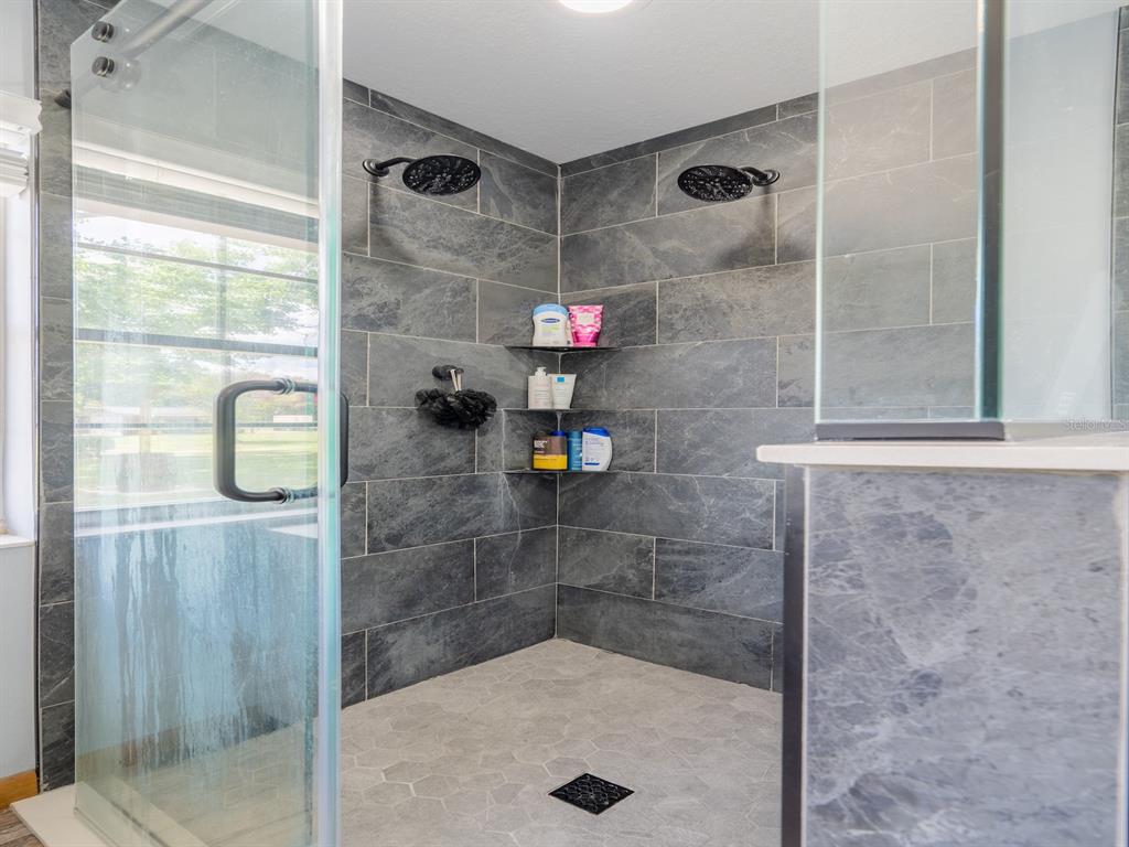 4381 Northeast 105th Place Anthony, FL 32617 - Photo 27 of 49 a bathroom with a shower