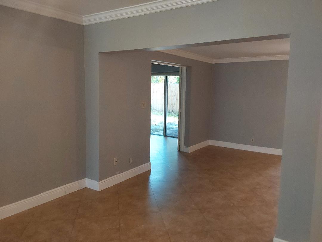 98 Seminole Lane Boca Raton, FL 33487 - Photo 32 of 42 a view of an empty room with wooden floor and a window