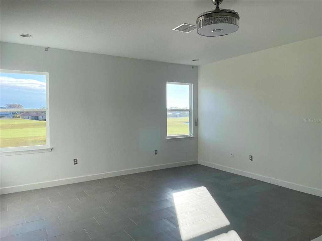 17708 Sawgrass Run Tavares, FL 32778 - Photo 34 of 79 an empty room with a window