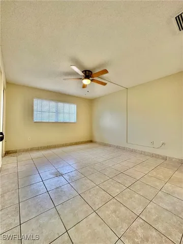 a spacious bathroom with a toilet sink and mirror
