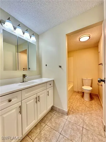 a bathroom with a toilet and a bathtub