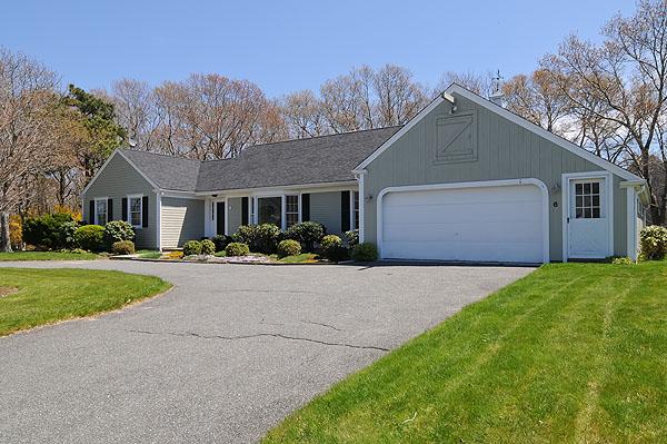 6 East Crossfield Road Sandwich, MA 02644 - Photo 2 of 3 a front view of house with yard and green space