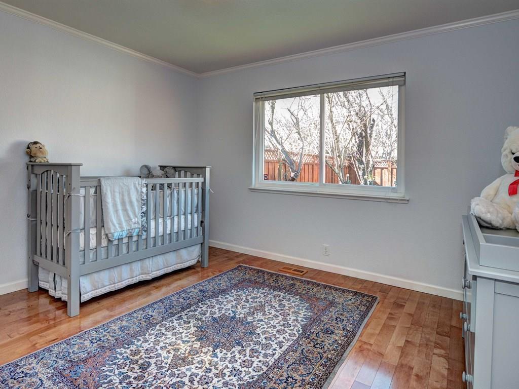 659 Marsh Road Menlo Park, CA 94025 - Photo 12 of 16 a view of a room with wooden floor and a rug