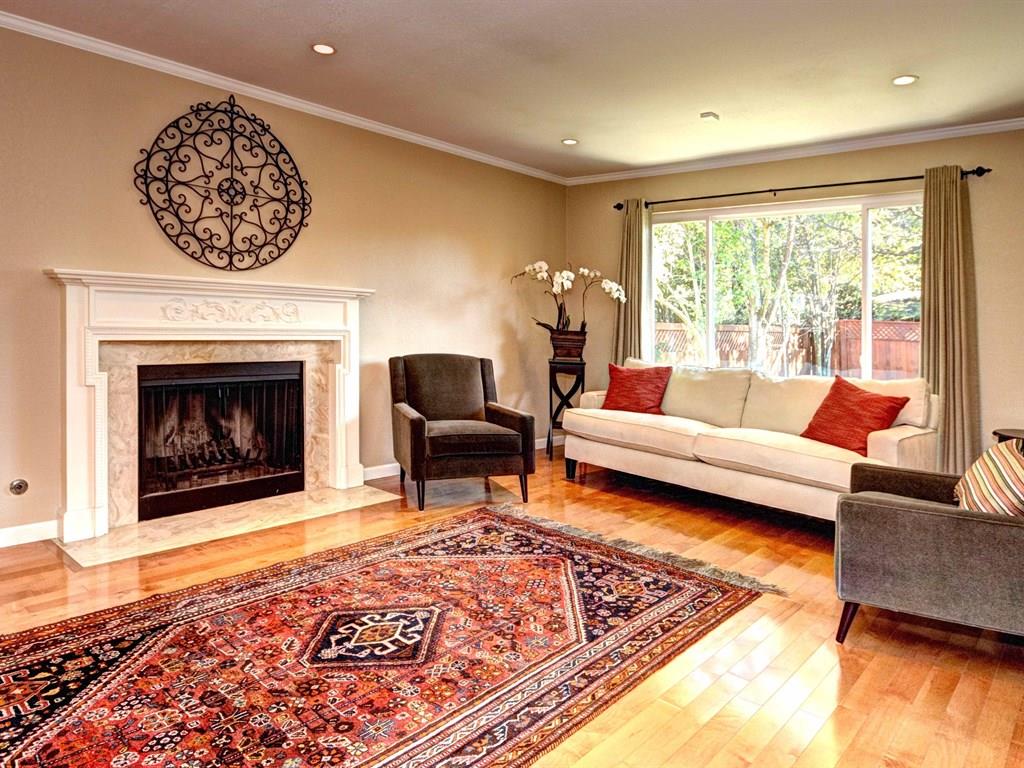 659 Marsh Road Menlo Park, CA 94025 - Photo 2 of 16 a living room with furniture and a fireplace