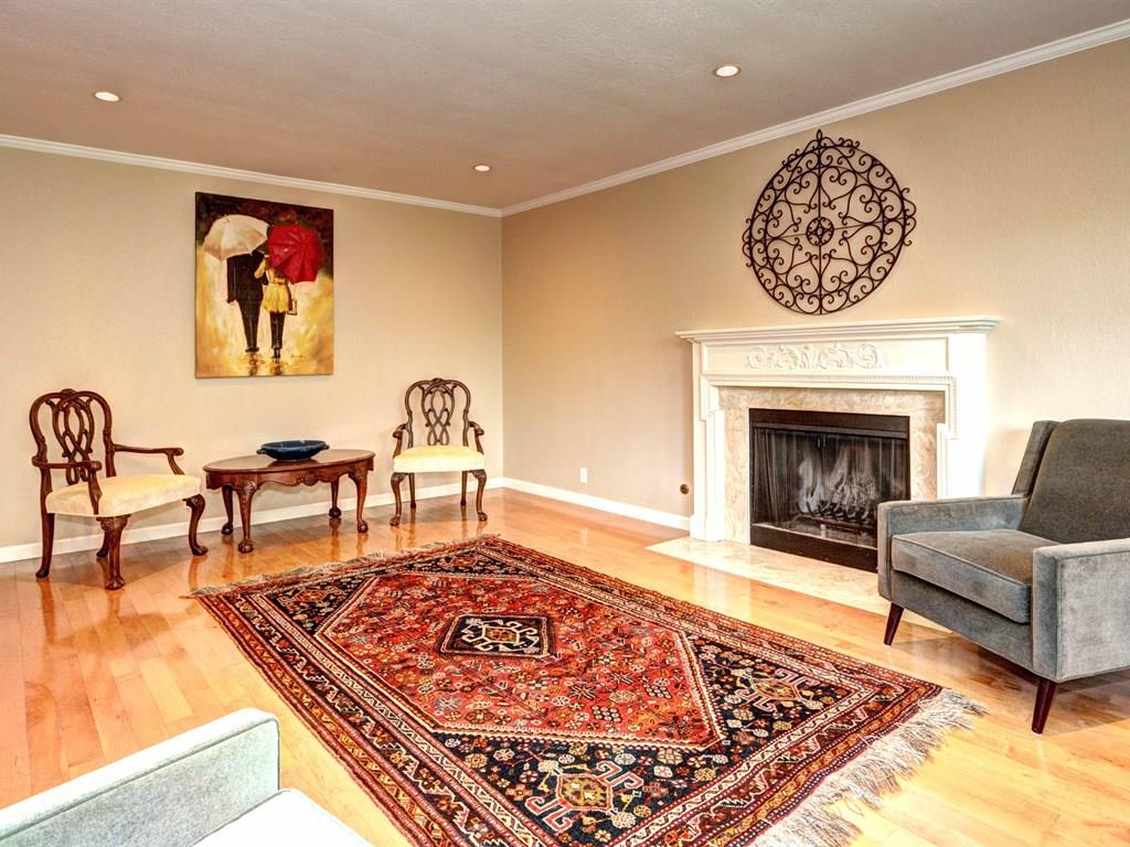 659 Marsh Road Menlo Park, CA 94025 - Photo 3 of 16 a living room with furniture rug and a fireplace
