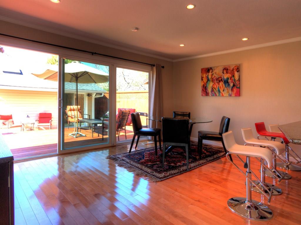 659 Marsh Road Menlo Park, CA 94025 - Photo 4 of 16 a living room with furniture floor to ceiling window and wooden floor