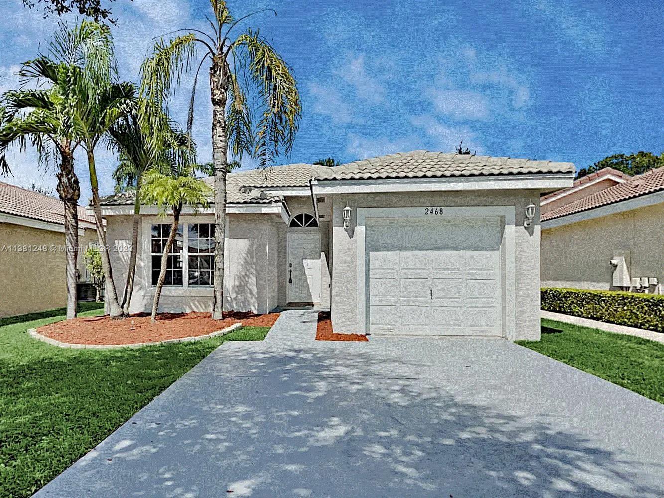 Silver Lakes Miramar, FL 33029 - Photo 1 of 17 front view of a house with a yard