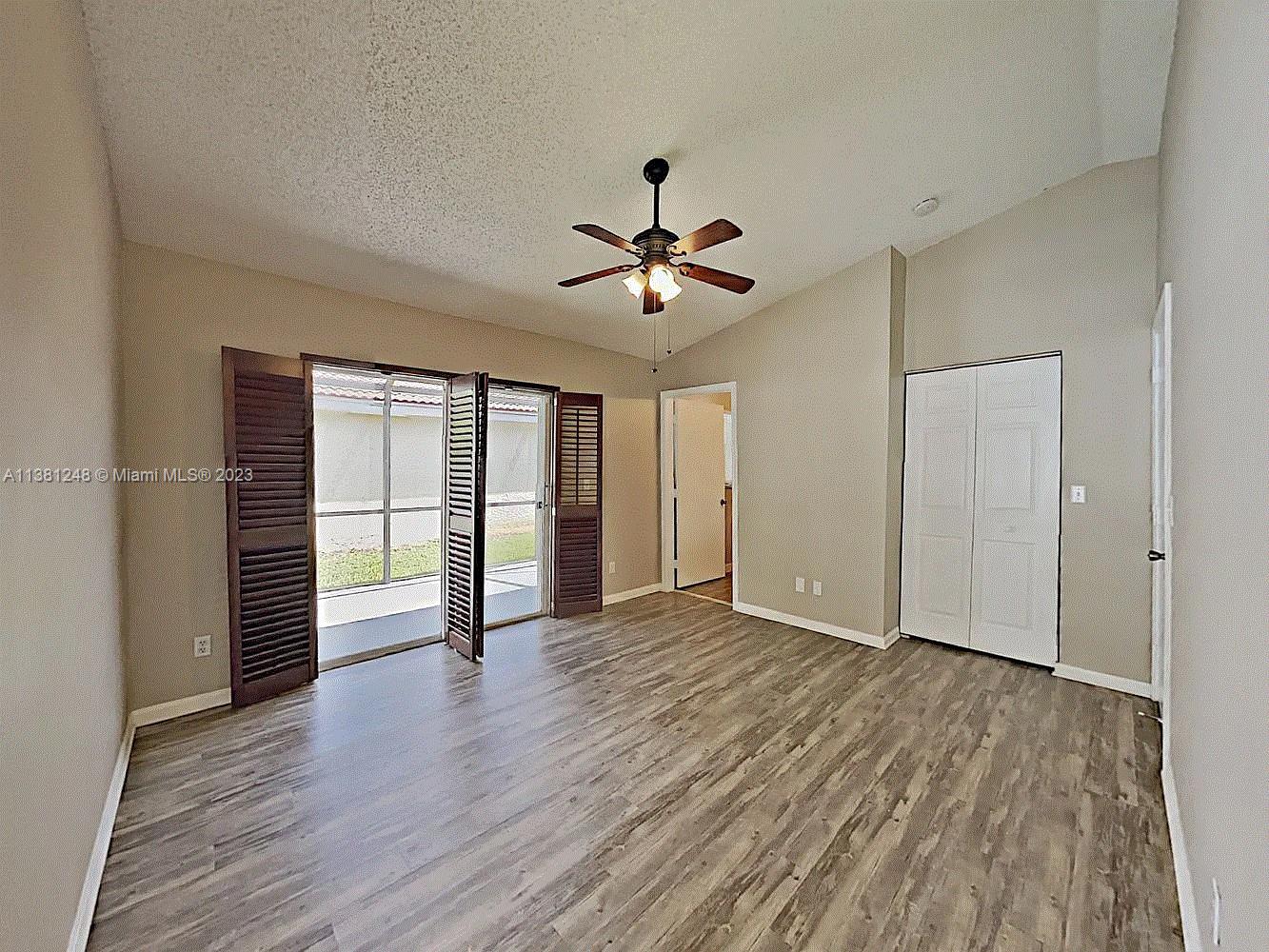 Silver Lakes Miramar, FL 33029 - Photo 3 of 17 wooden floor in an empty room with a window
