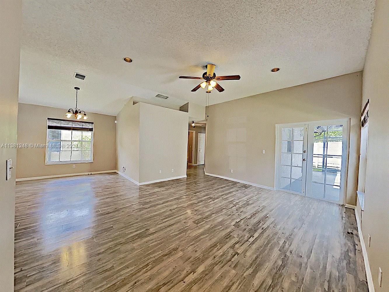 Silver Lakes Miramar, FL 33029 - Photo 4 of 17 a view of an empty room with window and wooden floor