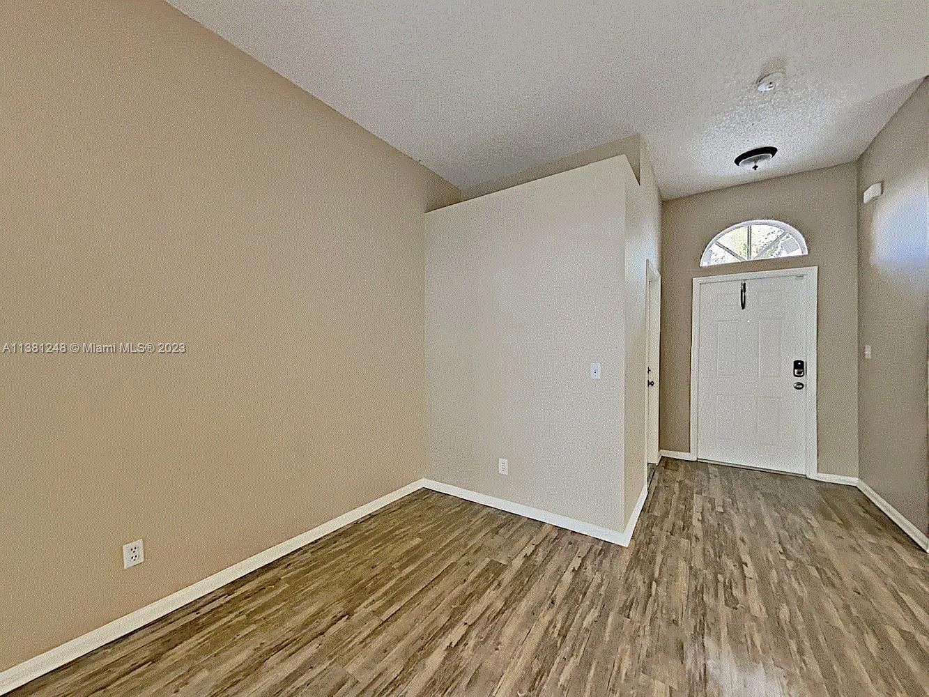 Silver Lakes Miramar, FL 33029 - Photo 5 of 17 a view of empty room with wooden floor and fan